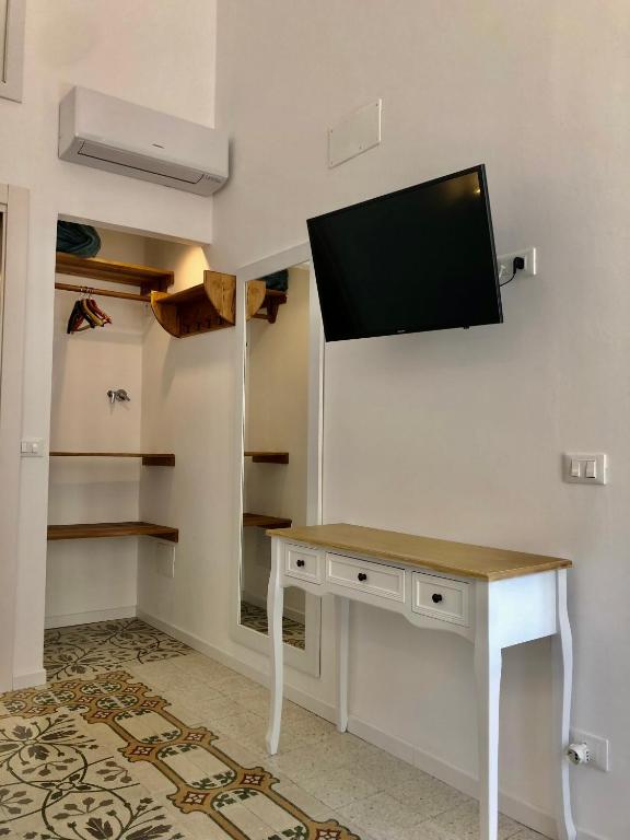Televízia a/alebo spoločenská miestnosť v ubytovaní Casa Colore Loft