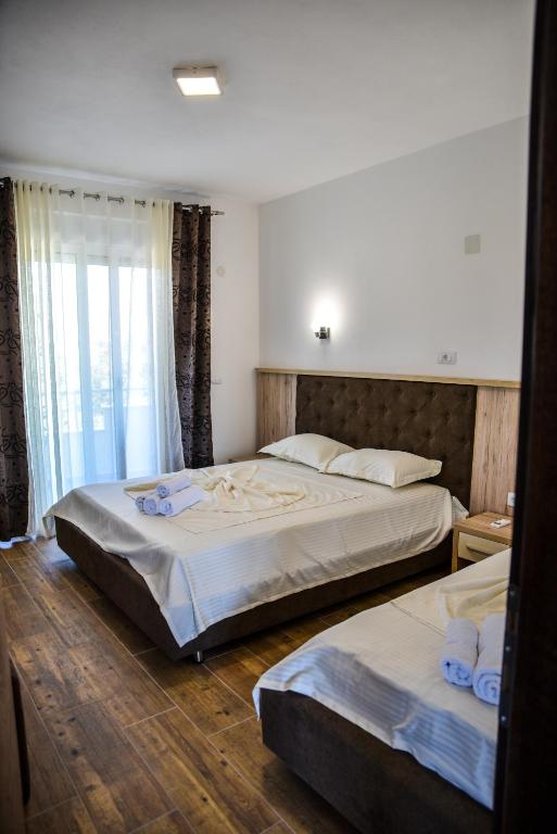 Postel nebo postele na pokoji v ubytování Casa Sinani