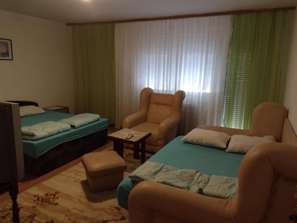 Postel nebo postele na pokoji v ubytování Ćane Rooms