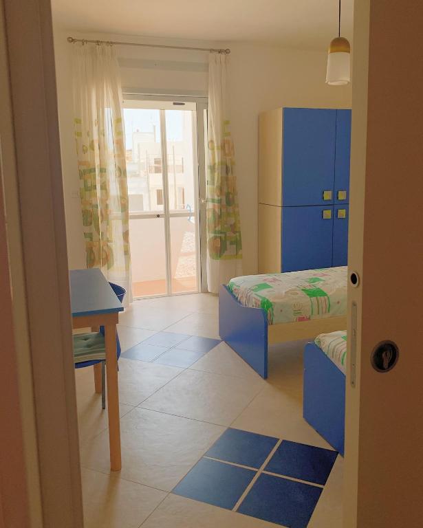 Postel nebo postele na pokoji v ubytování Acquazzura Salento Torre Mozza