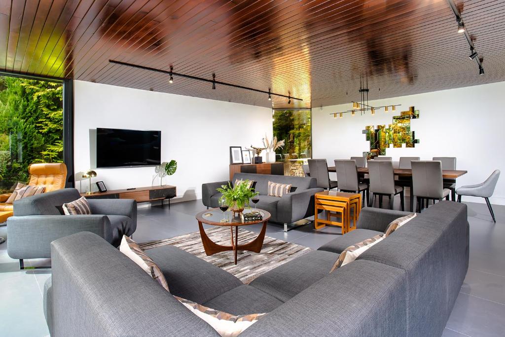 a living room with couches and a dining room at Sweden Lodge - wonderful property in Ambleside in Ambleside