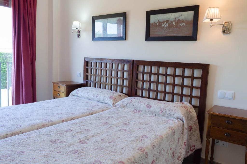 Postel nebo postele na pokoji v ubytování Hotel El Rondón