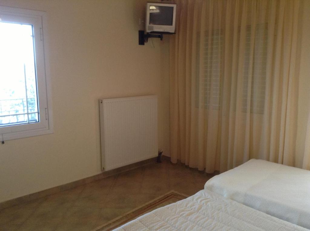 Postel nebo postele na pokoji v ubytování Guesthouse Lamprini
