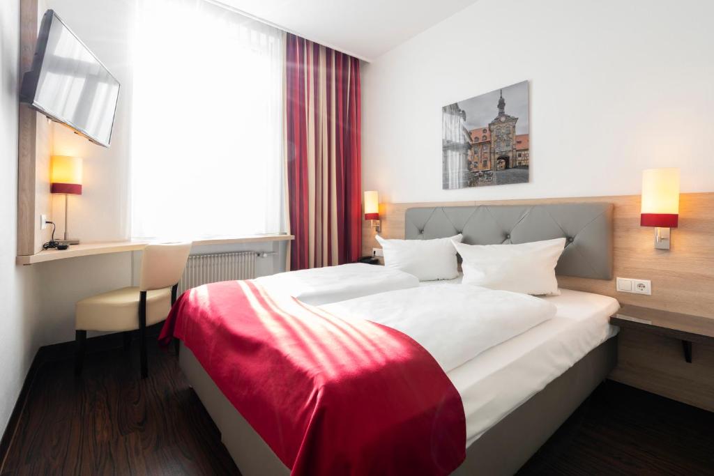 Postel nebo postele na pokoji v ubytování Hotel National