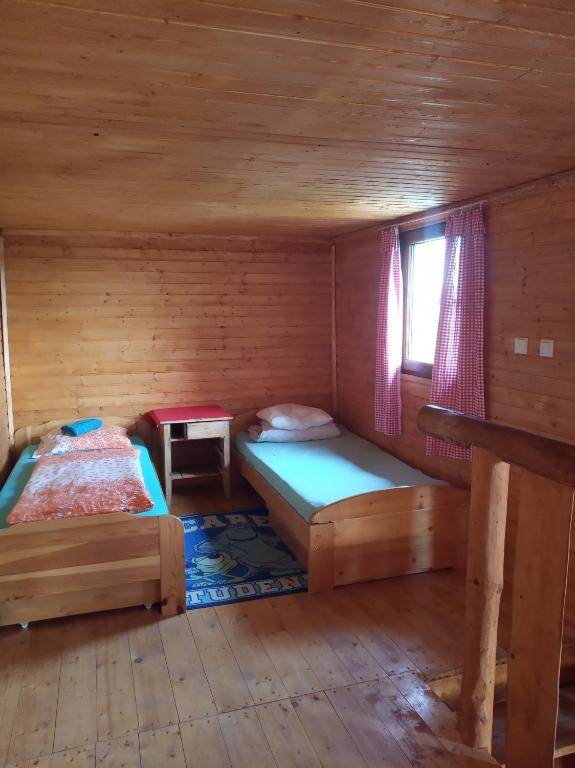 Postel nebo postele na pokoji v ubytování chata FRIDAY