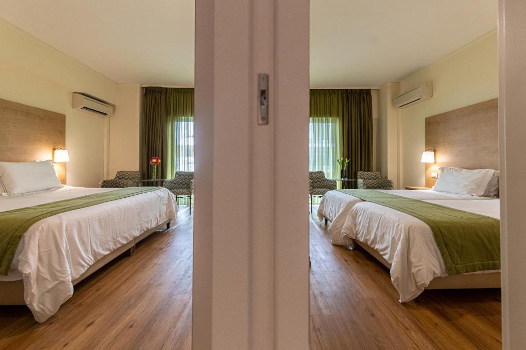 Postel nebo postele na pokoji v ubytování Polis Grand Hotel