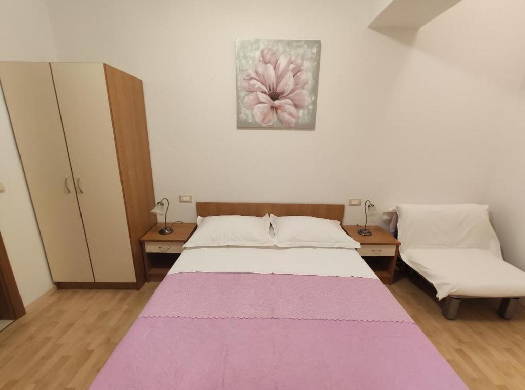 Posteľ alebo postele v izbe v ubytovaní Apartment Tino
