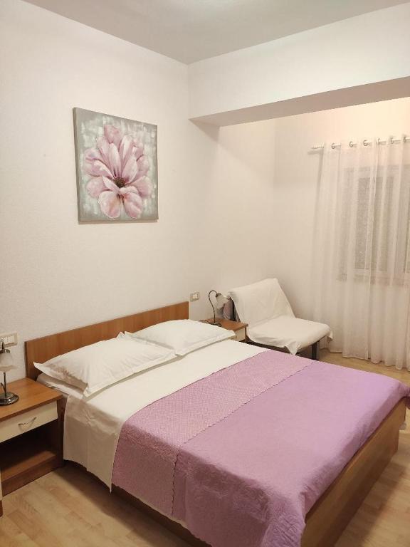 Posteľ alebo postele v izbe v ubytovaní Apartment Tino