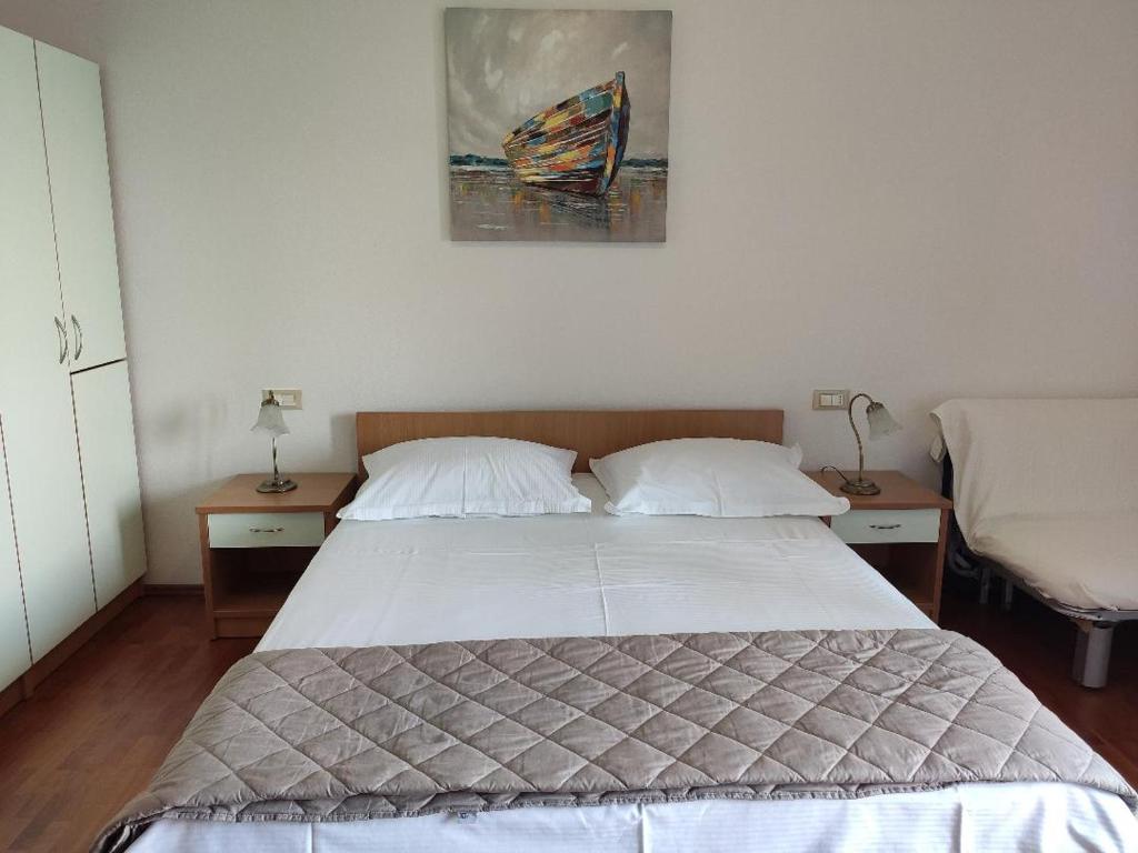 Posteľ alebo postele v izbe v ubytovaní Apartment Tino