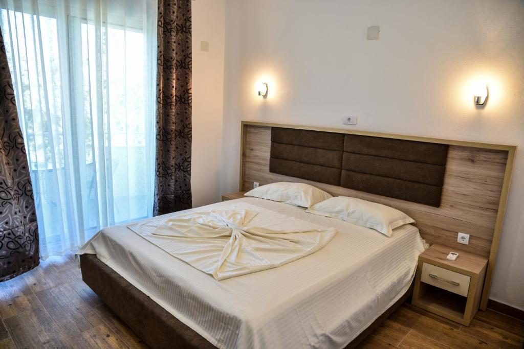Postel nebo postele na pokoji v ubytování Casa Sinani