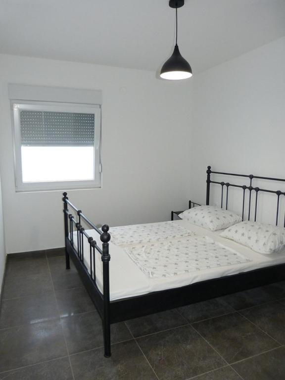 Posteľ alebo postele v izbe v ubytovaní Apartment NoStress