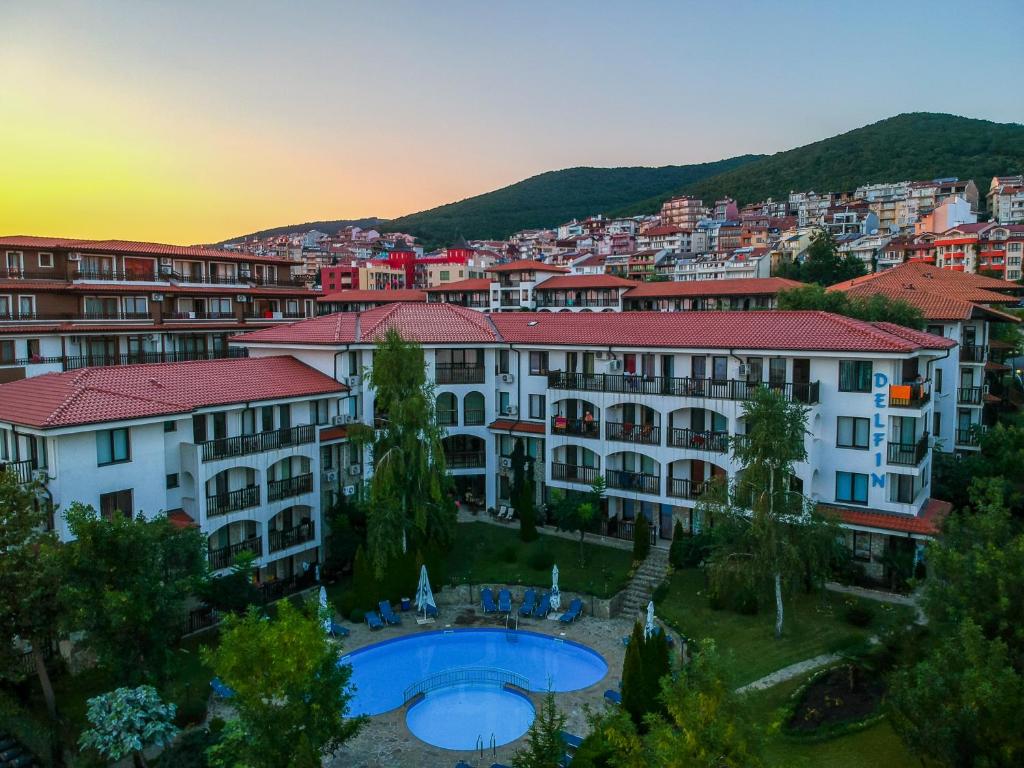 a view of a resort with a pool and buildings at Delfin Port Apartments - Prime Location & Parking & Pet Friendly in Sveti Vlas