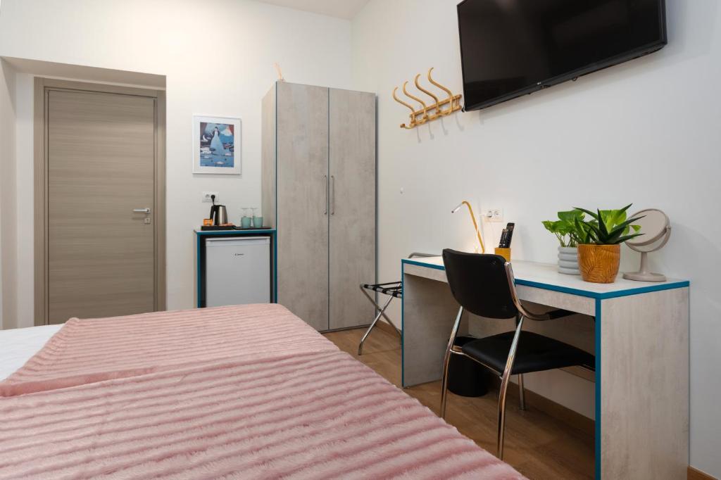 TV a/nebo společenská místnost v ubytování Polesana Rooms