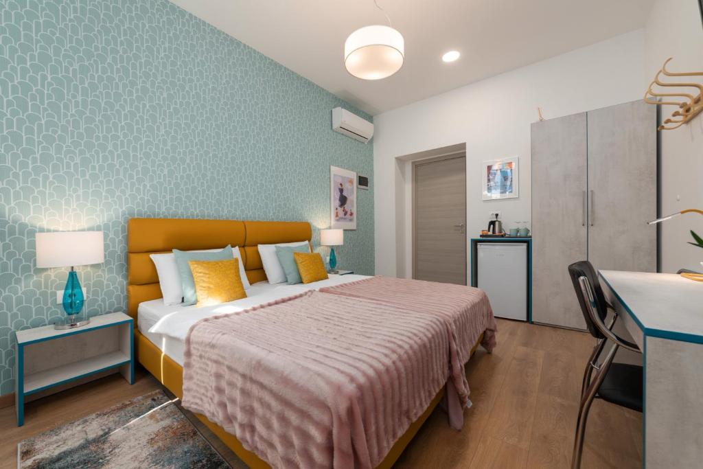 Postel nebo postele na pokoji v ubytování Polesana Rooms