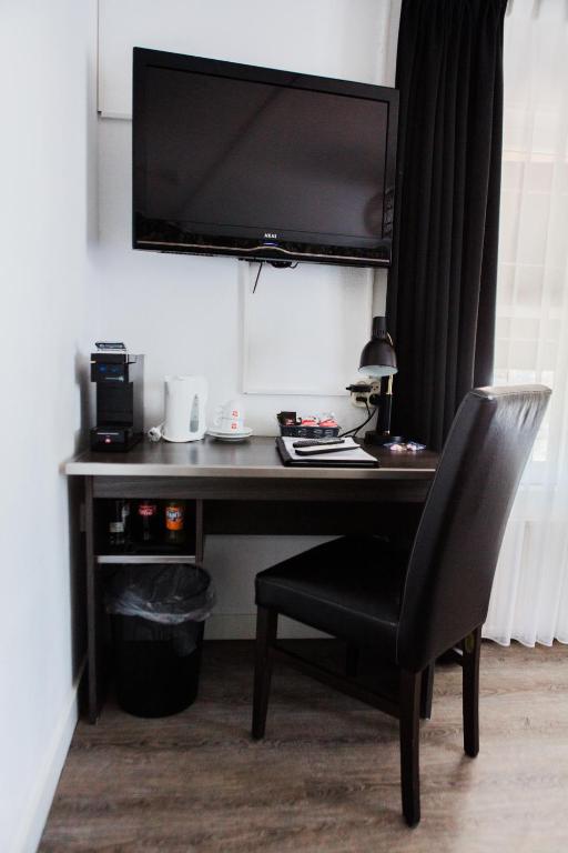 TV a/nebo společenská místnost v ubytování Hanze Hotel Zwolle
