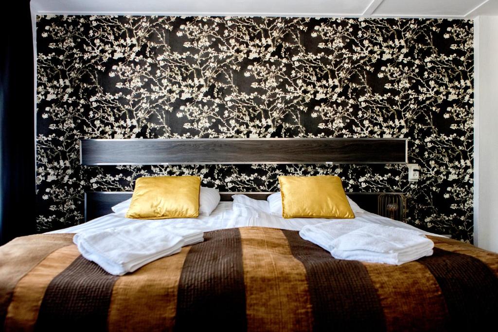 Postel nebo postele na pokoji v ubytování Hanze Hotel Zwolle
