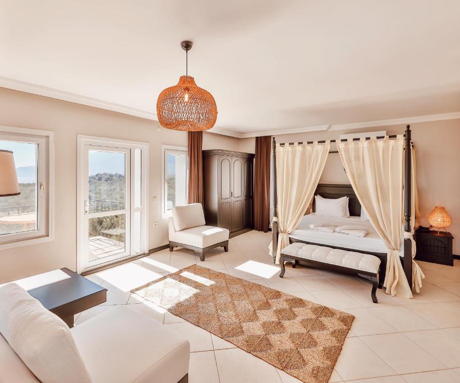 a bedroom with a bed and a couch and a table at Hill House Adult Only in Kaş