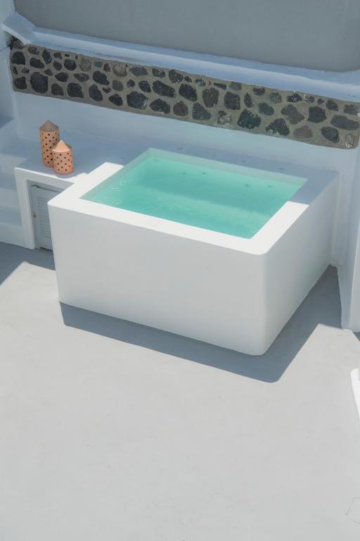 Fotografie z fotogalerie ubytování AQUA SERENITY LUXURY SUITES SANTORINI v destinaci Foinikiá