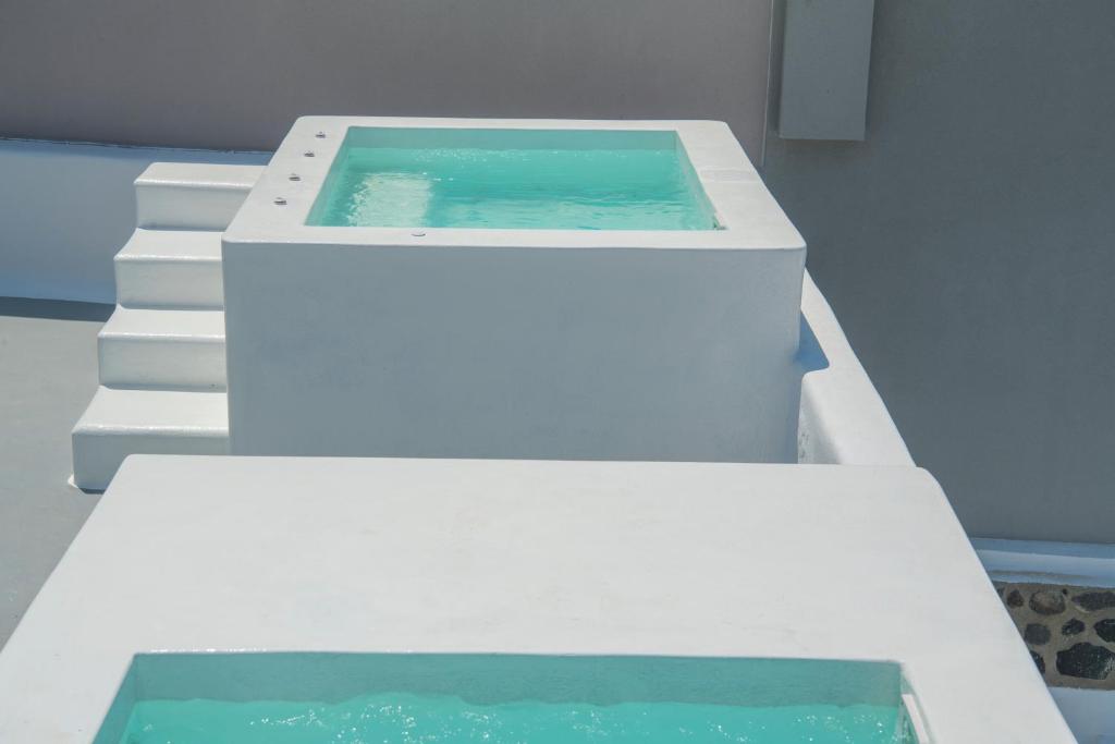 Fotografie z fotogalerie ubytování AQUA SERENITY LUXURY SUITES SANTORINI v destinaci Foinikiá