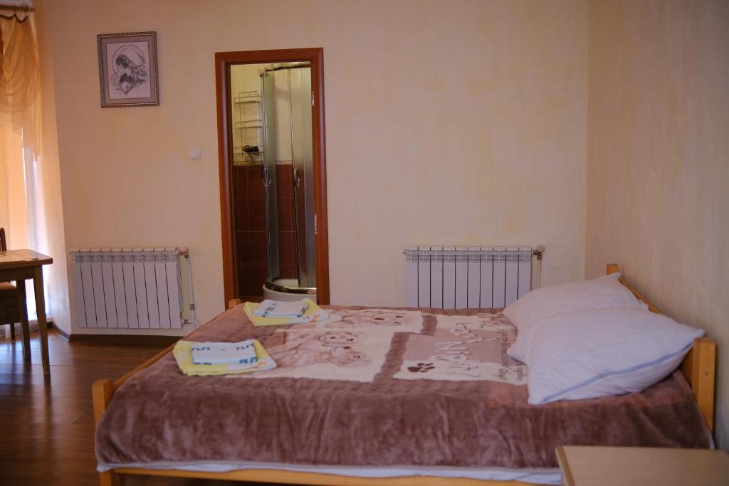 Postel nebo postele na pokoji v ubytování Дідів Рай
