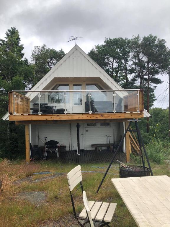a large house with a glass roof on top of it at Kjekstadveien 22 Homborsund in Jordtveit
