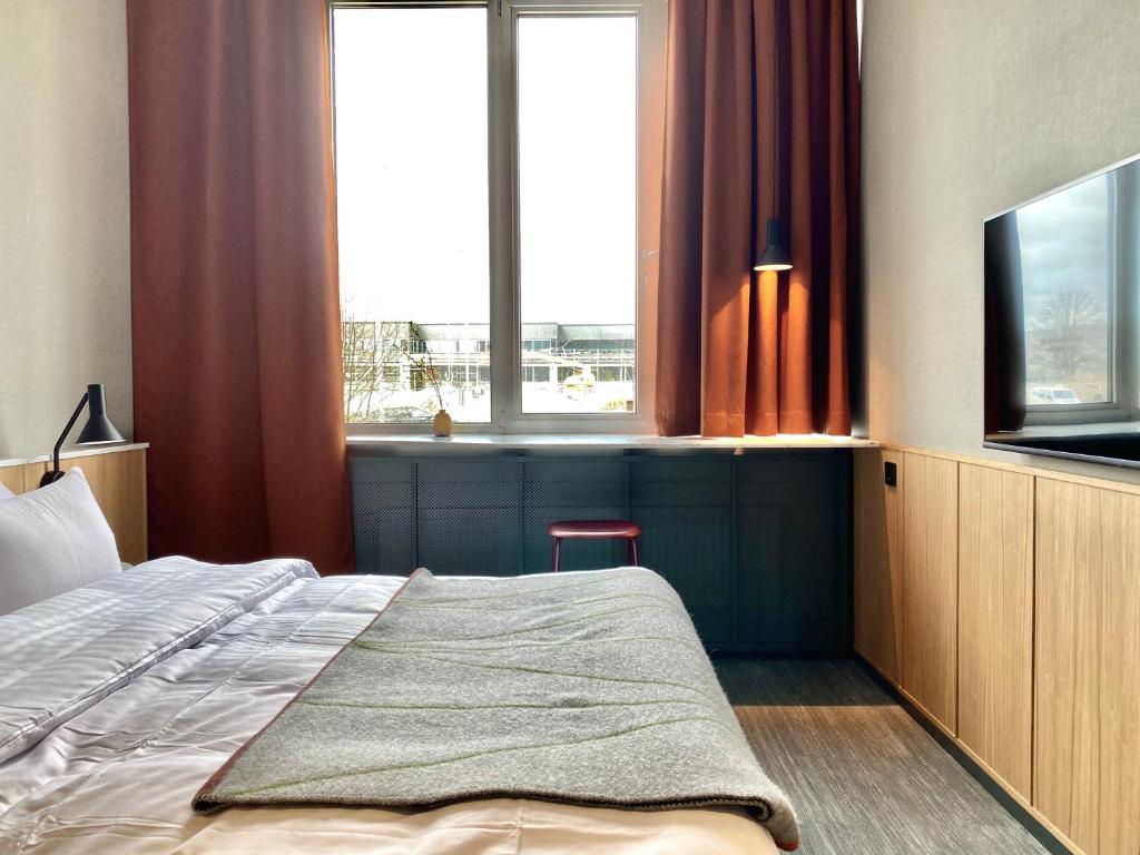 Postel nebo postele na pokoji v ubytování Mornington Hotel Bromma