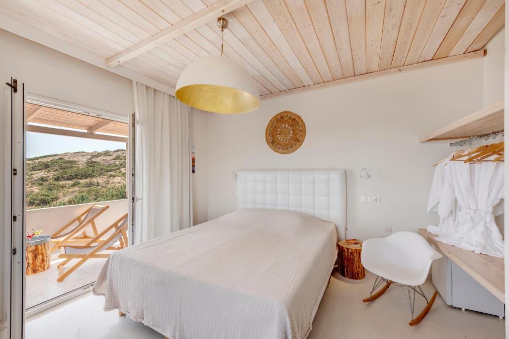 Postel nebo postele na pokoji v ubytování Faros Resort