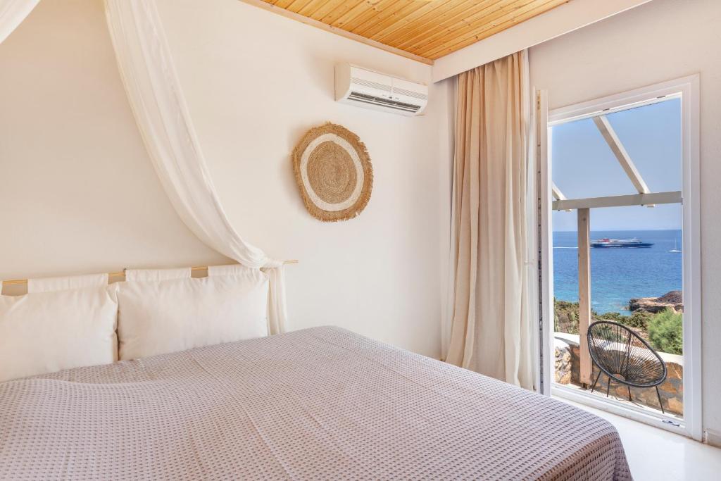 Postel nebo postele na pokoji v ubytování Faros Resort