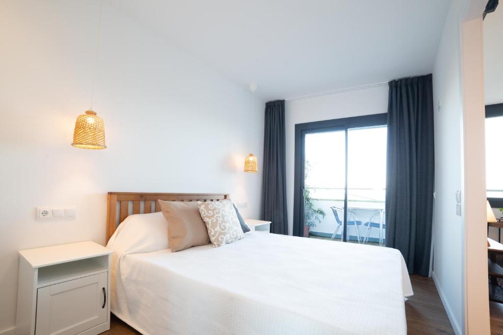 Postel nebo postele na pokoji v ubytování Apartaments Voralmar