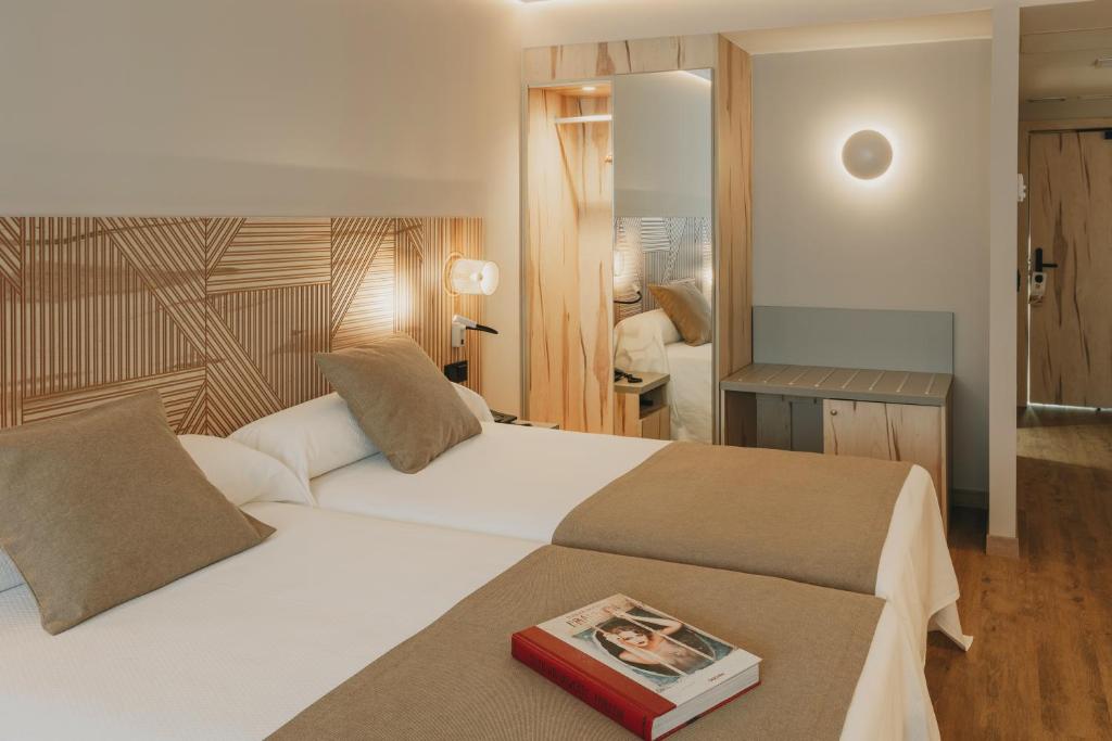 Postel nebo postele na pokoji v ubytování Hotel El Mirador