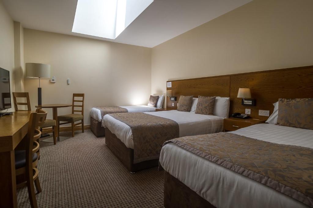 Letto o letti in una camera di The Carraig Hotel