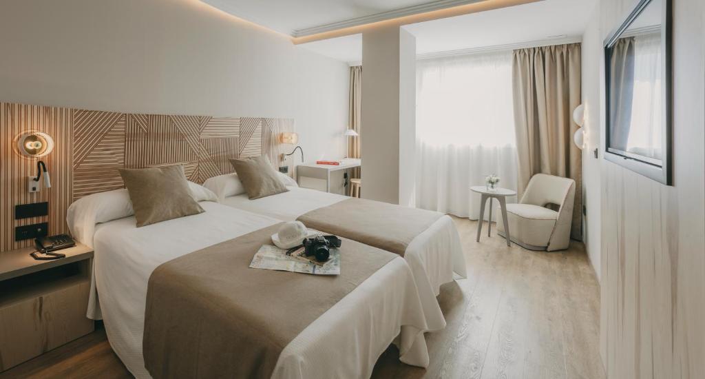 Postel nebo postele na pokoji v ubytování Hotel El Mirador