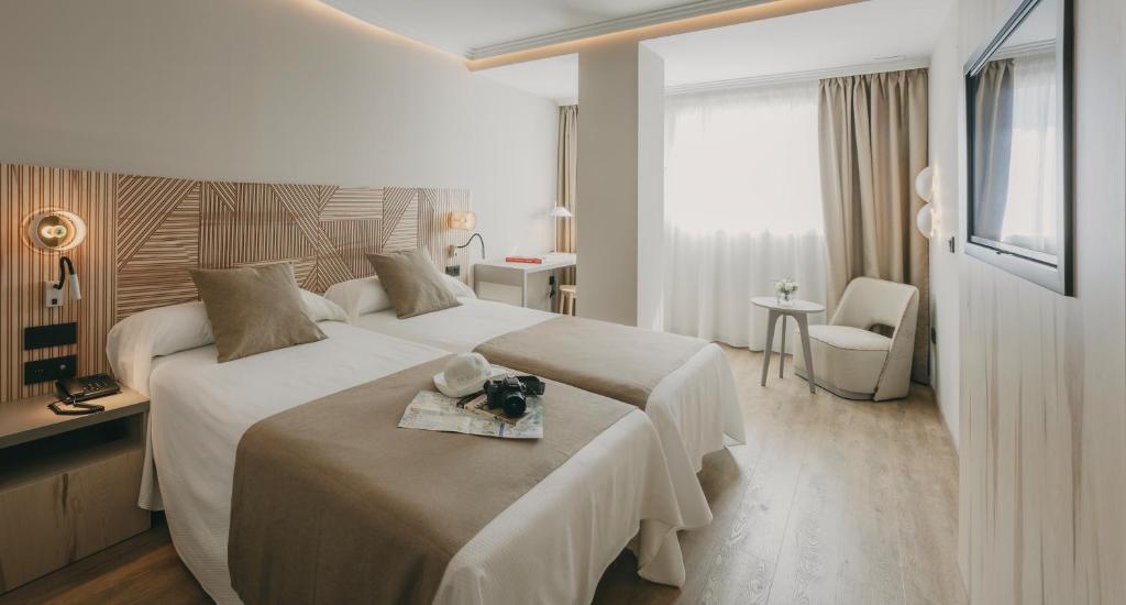 A bed or beds in a room at Hotel El Mirador