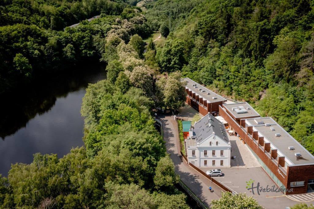 an aerial view of a building next to a river at Restaurace a Pension Hřebíkárna in Chomutov