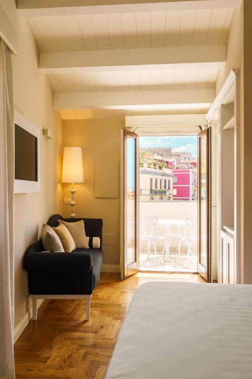 Postel nebo postele na pokoji v ubytování Boutique Hotel Carlo Felice