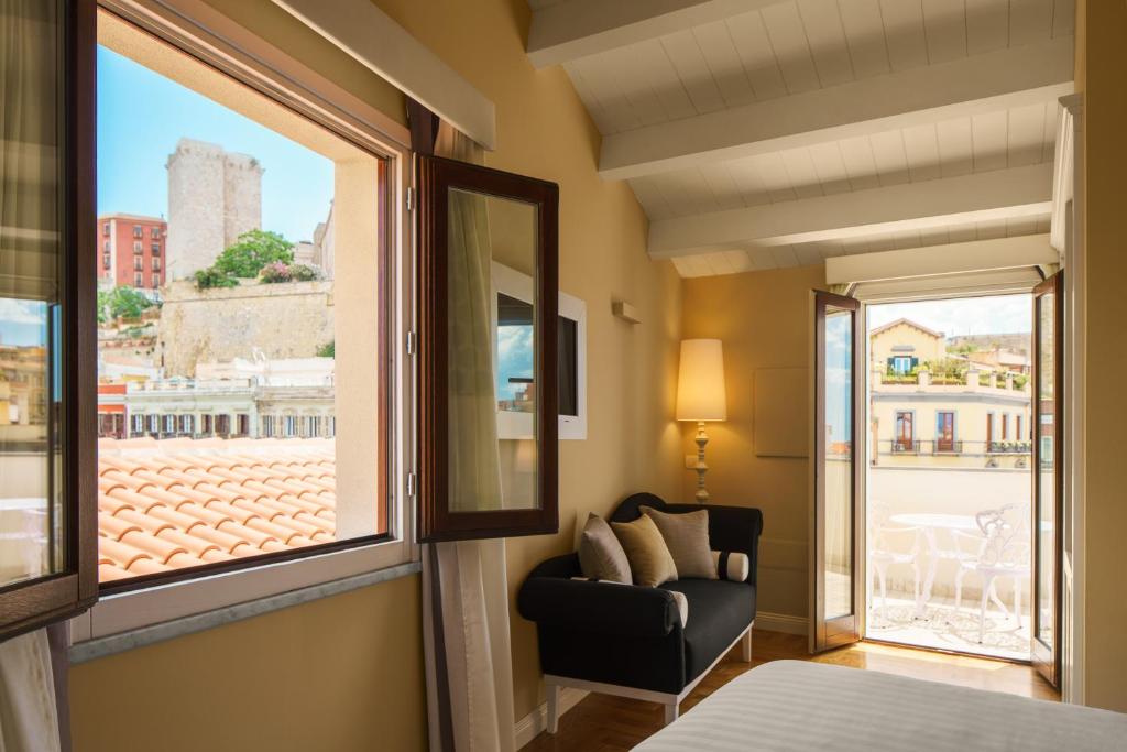 Postel nebo postele na pokoji v ubytování Boutique Hotel Carlo Felice