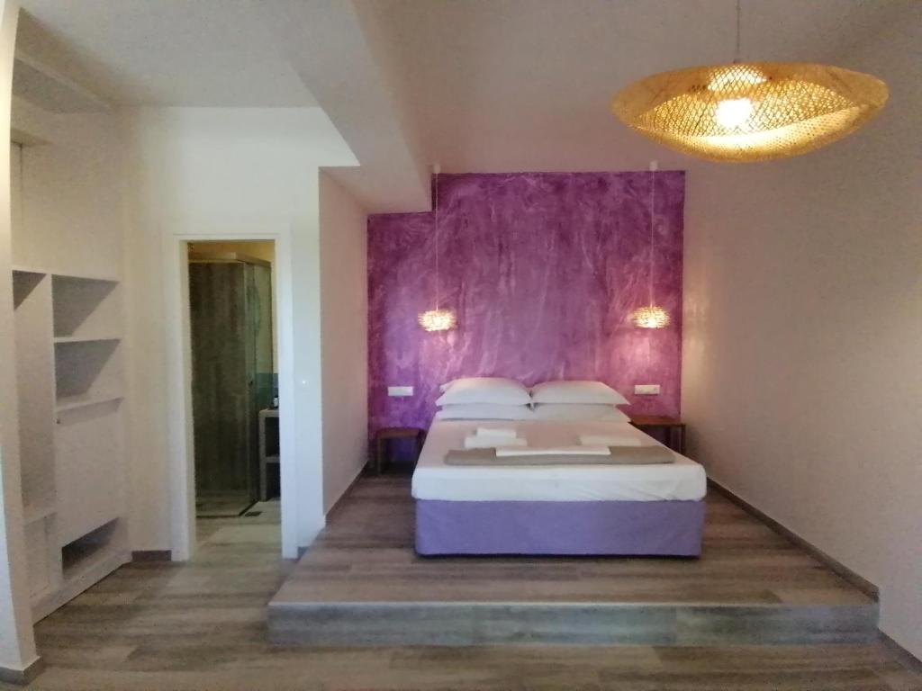 Postel nebo postele na pokoji v ubytování Villa Nena - Studio Suites