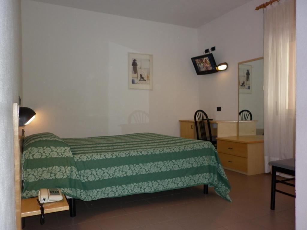 Postel nebo postele na pokoji v ubytování Hotel Aurora