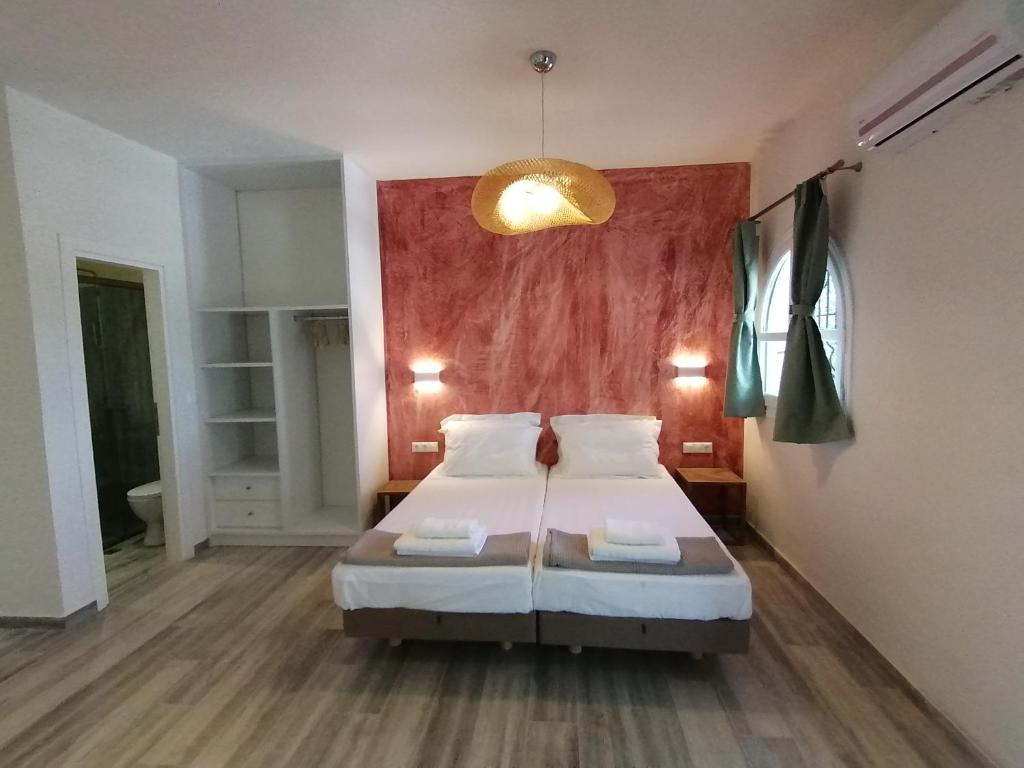 Postel nebo postele na pokoji v ubytování Villa Nena - Studio Suites