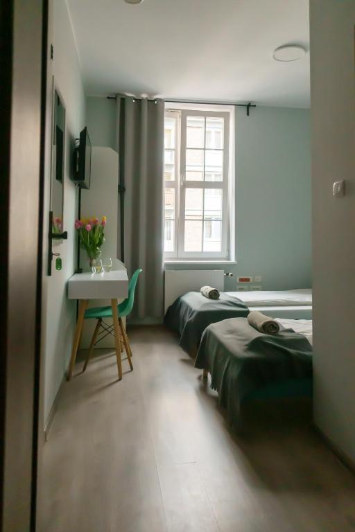Posteľ alebo postele v izbe v ubytovaní Trip & Hostel