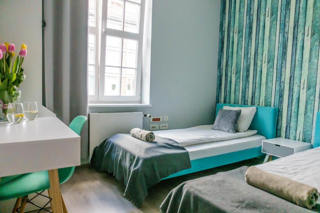 Posteľ alebo postele v izbe v ubytovaní Trip & Hostel