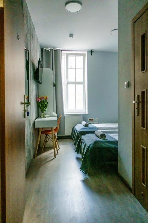 Posteľ alebo postele v izbe v ubytovaní Trip & Hostel