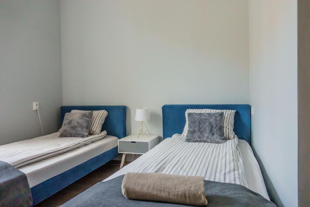Posteľ alebo postele v izbe v ubytovaní Trip & Hostel