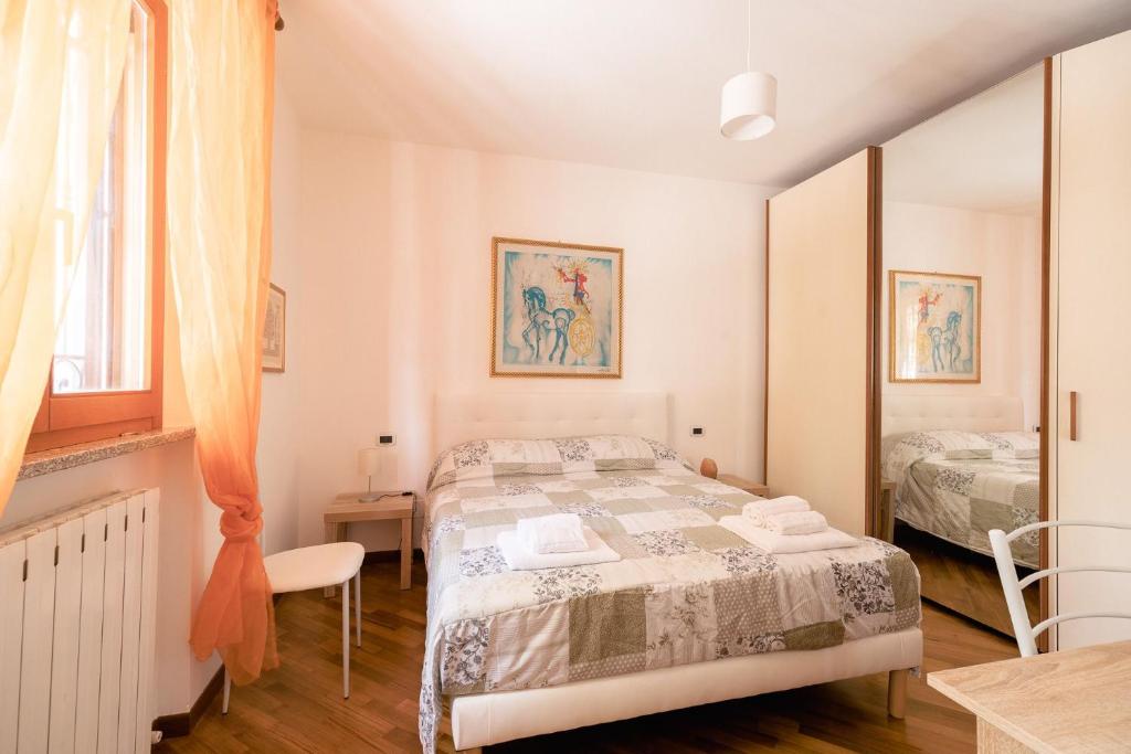 Postel nebo postele na pokoji v ubytování Les Chambres