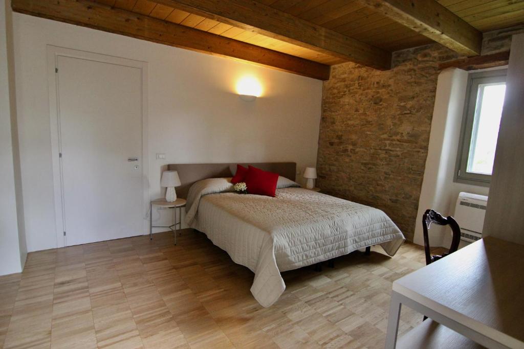 Postel nebo postele na pokoji v ubytování Relais Mevigo - Casa Pietra