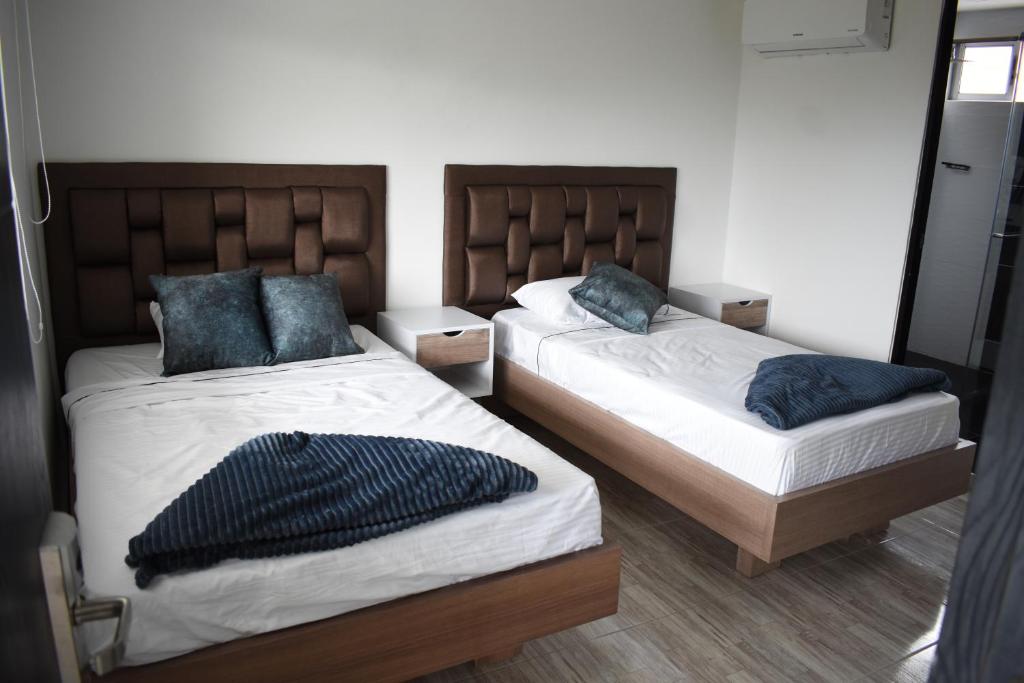 Postel nebo postele na pokoji v ubytování Hostel Boutique Nido de Loros