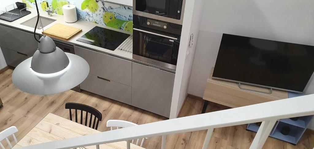 Kuchyňa alebo kuchynka v ubytovaní Apartamentos Antares 3
