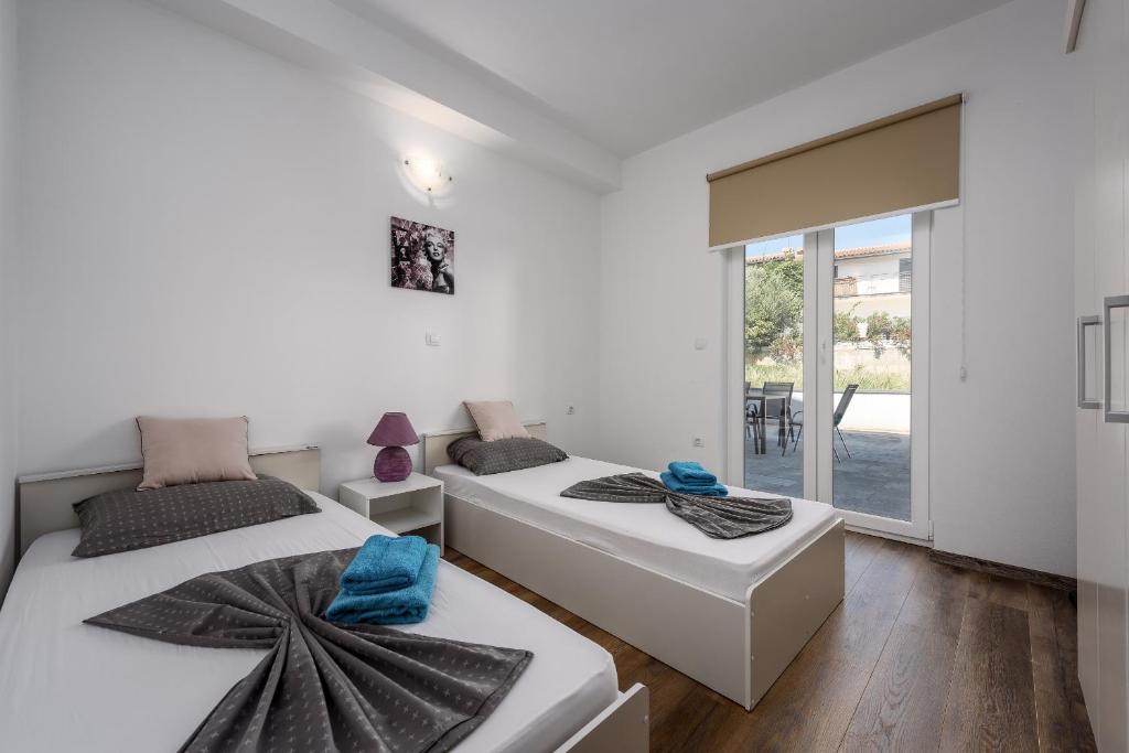 Postel nebo postele na pokoji v ubytování Apartment Monika with private pool in Porec