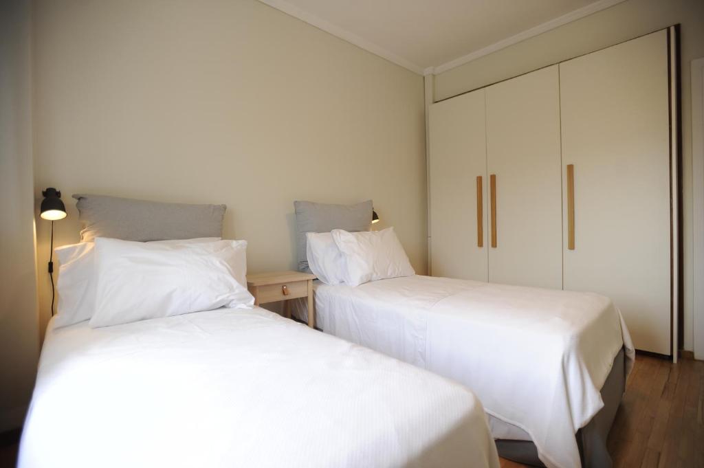 A bed or beds in a room at Sea & City views, Aspa’s apartment