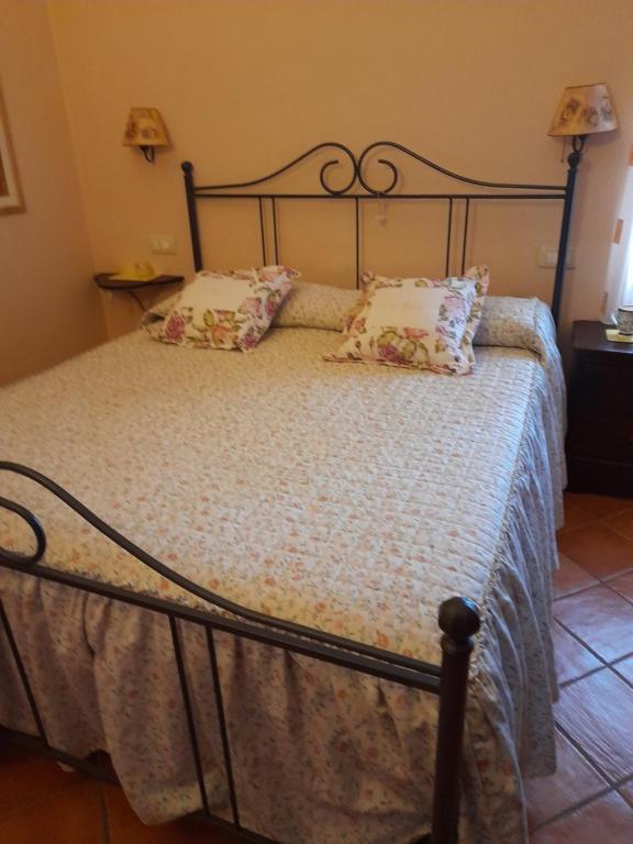 Łóżko lub łóżka w pokoju w obiekcie Gli Ulivi Bed & breakfast